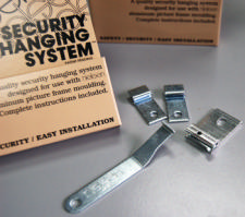 Security hangers for metal picture frames